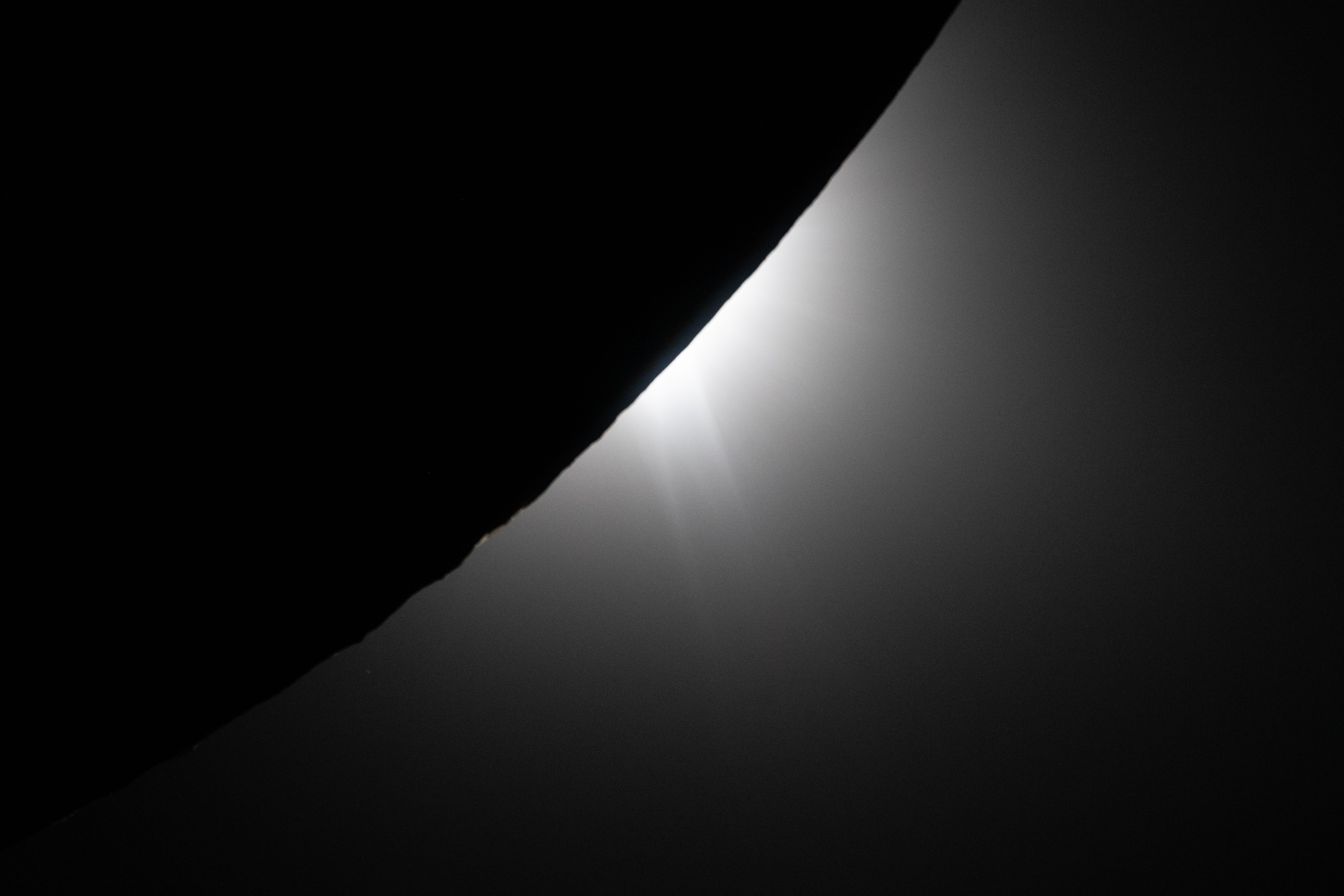 the edge of the moon is silhoutted against the light of the Sun.