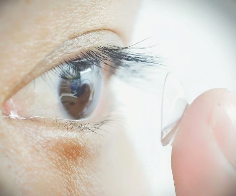 Study participant putting infrared contacts in their eye